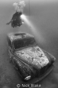 London Taxi Cab and diver, Wraysbury Lake, Middlesex by Nick Blake 